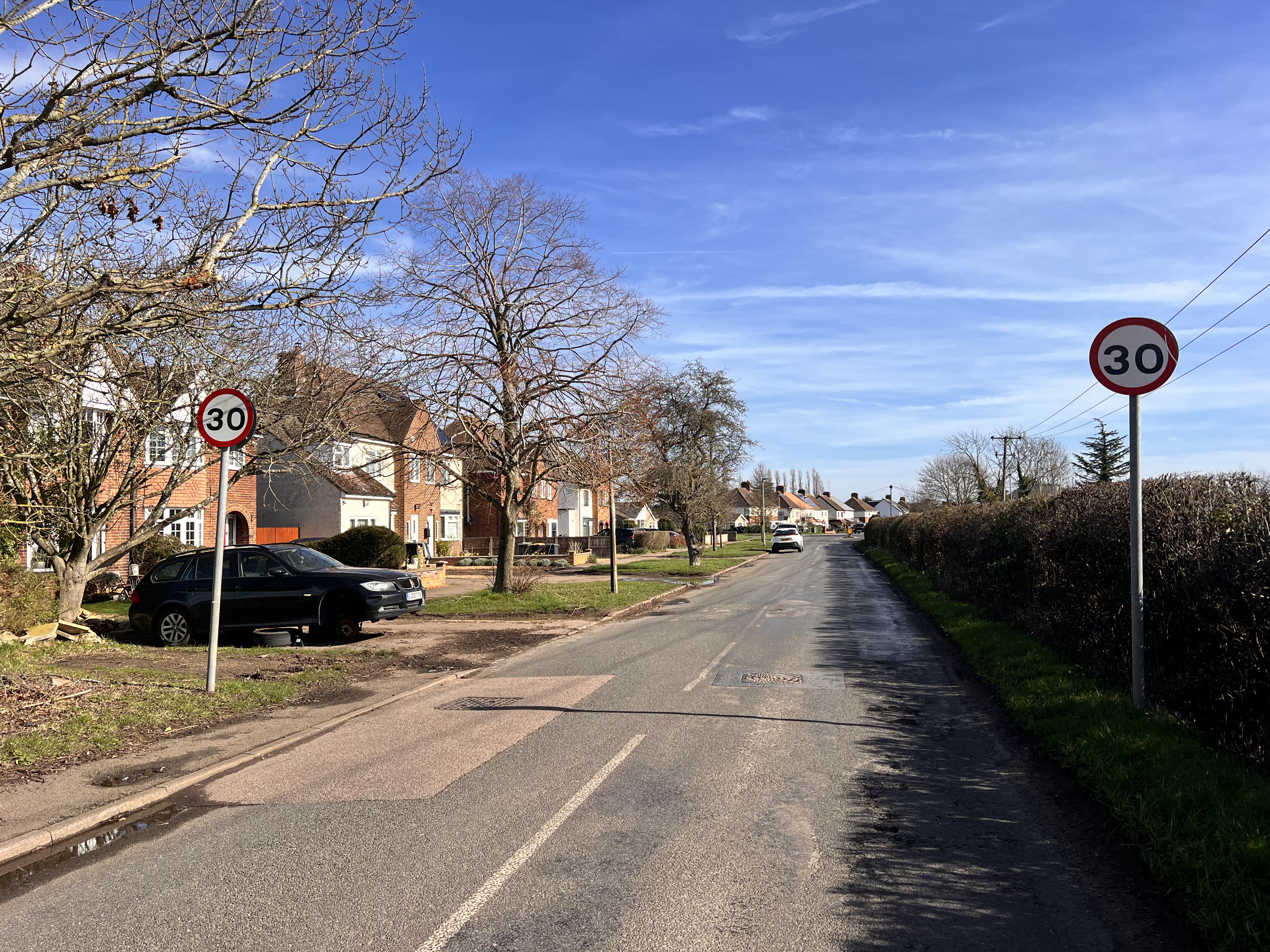 Village road with 30mph signs at Kempston Rural
